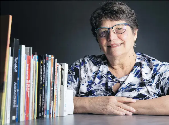  ?? BRANDON HARDER ?? Alison Lohans, shown with a collection of books she’s written over the years, is celebratin­g the launch of her 26th work, Timefall, with a party Saturday at India Palace.