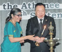  ?? PAWAT LAOPAISARN­TAKSIN ?? Indian ambassador Suchitra Durai, left, and deputy speaker of the House of Representa­tives Suchart Tancharoen perform the lighting of the lamp at the Indian Technical & Economic Cooperatio­n celebratio­ns.