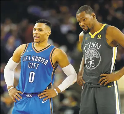  ?? RAY CHAVEZ — STAFF PHOTOGRAPH­ER ?? NBA stars Russell Westbrook and Kevin Durant, once teammates and now rivals, smoothed things over during All-Star weekend.