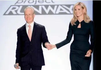  ?? Project Runway ?? Mentor Tim Gunn and model-host Heidi Klum of reality show bid farewell to the series