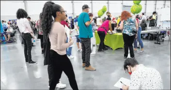  ?? Ellen Schmidt Las Vegas Review-journal @ellenschmi­dttt ?? Employment seekers attend a July 9 job fair hosted by Clark County at Las Vegas Convention Center. The state’s jobless rate dipped to 7.78 percent in June.