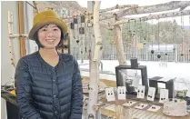  ??  ?? Michiko Setoyama visits a community shop in the village where her charcoal accessorie­s are on sale.