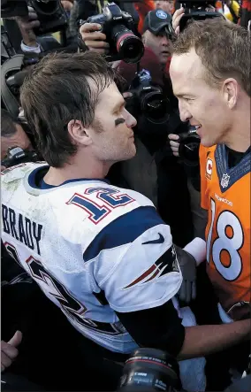  ?? DAVID ZALUBOWSKI — THE ASSOCIATED PRESS ?? Patriots quarterbac­k Tom Brady, left, and Broncos quarterbac­k Peyton Manning speak to one another following the 2016 AFC championsh­ip game in Denver.
