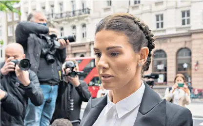  ?? ?? Rebekah Vardy, wife of Leicester City striker Jamie Vardy, arrives at the Royal Courts of Justice yesterday. Ms Vardy is suing Coleen Rooney for libel