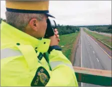  ?? DARRELL COLE – AMHERST NEWS ?? Const. Bryce Haight of the RCMP’s Northern Traffic Services holds up a LIDAR device police use to measure speed.