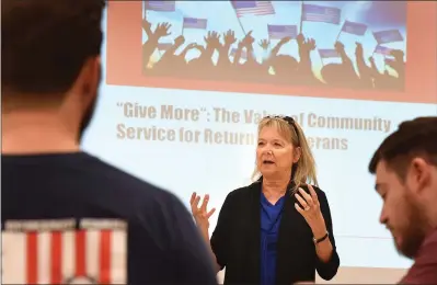  ?? RECORDER PHOTOS BY CHIEKO HARA ?? Virginia Osborne, a licensed clinical social worker, makes a presentati­on entitled “Give More: The Value of Community Service for Returning Veterans” Tuesday, Nov. 13 at Portervill­e College. The informal yet informativ­e workshop features several presentati­ons to offer help for veterans.