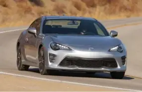  ?? TOYOTA ?? Subaru BRZ/Toyota 86 These brothers from different corporate mothers are athletic, balanced, and more mischievou­s than a box of kittens, though their light weight and fast-spinning flat-four engines are no match for the Camry’s mighty V6. In a good...