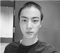  ?? AP ?? JIN of K-pop band BTS shows off freshly shaved hair.