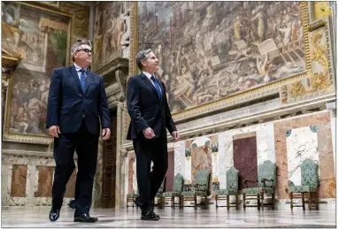  ?? ANDREW HARNIK — THE ASSOCIATED PRESS ?? Secretary of State Antony Blinken, right, accompanie­d by Chargé d’Affaires of the U.S. Embassy to the Holy See Patrick Connell, left, tours on June 28the Sala Regia at the Vatican in Rome.