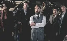  ?? WARNER BROS. PICTURES VIA AP ?? This image released by Warner Bros. Pictures shows (from left) Jessica Williams, Callum Turner, Jude Law, Fionna Glascott, Dan Fogler and Eddie Redmayne in a scene from “Fantastic Beasts: The Secrets of Dumbledore.”