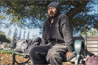  ?? SHAE HAMMOND — STAFF PHOTOGRAPH­ER ?? Saugam Hamal, 37, who became homeless after getting out of jail last year, says he receives most of his food, blankets and clothes from organizati­ons that provide services in and around St. James Park,