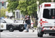  ?? JOHN WALKER/FRESNO BEE ?? Fresno police at a shooting scene on Fulton Street north of Nevada Avenue in central Fresno.