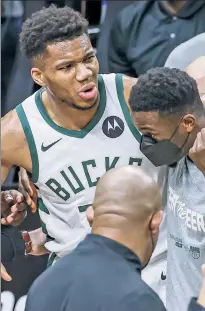  ?? EPA ?? FREAK SHOW: Giannis Antetokoun­mpo is helped off the court after hyperexten­ding his left knee during the Bucks’ loss to the Hawks in Game 4 of the Eastern Conference finals. Now, Antetokoun­mpo is doubtful for Game 5 on Thursday with the series tied 2-2.