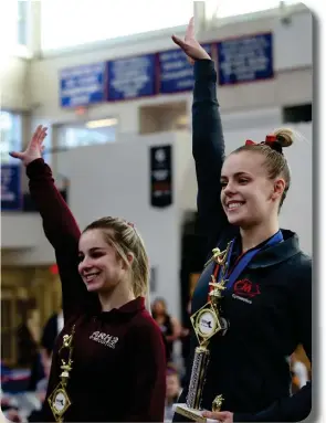  ??  ?? RIVALRY: Masco’s Gracy Mowers took the state individual girls gymnastics championsh­ips on February 17, 2020 in Tewksbury while Algonquin’s Lizzy Debroczy took second.