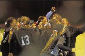  ?? BARRY BOOHER — THE NEWS-HERALD ?? South celebrates its 10-0 win over North on May 12 at Todd Field in Wiloughby.