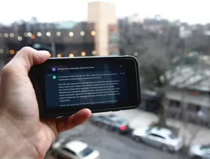  ?? PETER MORGAN/AP ?? A ChatGPT prompt is shown on a device near a public school in Brooklyn, New York.