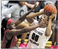  ?? Arkansas Democrat-Gazette/THOMAS METTHE ?? UALR senior Ronjanae DeGray (right) shoots while being defended by South Alabama junior Christen Carter during Saturday’s game at the Jack Stephens Center in Little Rock.