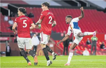  ?? REUTERS ?? Crystal Palace’s Wilfried Zaha scores their third goal against Manchester United at Old Trafford.