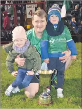  ?? (Pic: John Ahern) ?? Paddy, Caoimhe and Oisin Kenneally pictured with the cup in Páirc Uí Rinn last Saturday night.