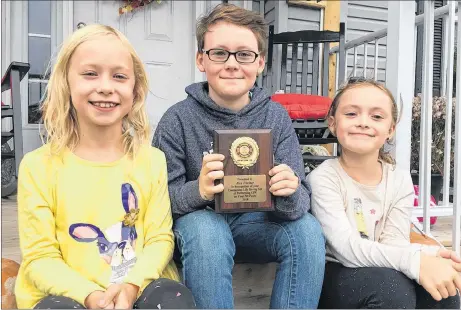  ?? SUEANN MUSICK/THE NEWS ?? Alex Pitcher of New Glasgow was recently honoured by the New Glasgow Fire Department for his life-saving skills after rescuing his dog Penny from their pool. His sisters Maddy, left, and Abbie were also instrument­al in alerting Alex and his parents, Steve and Heather, to the dog’s situation.