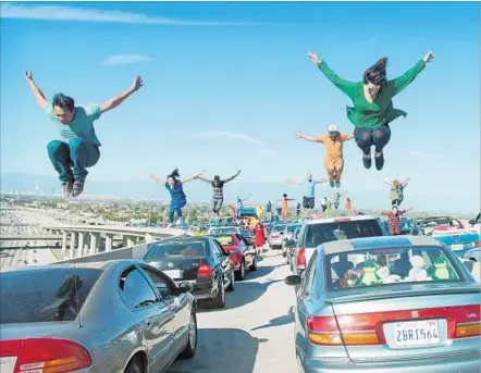  ?? Photograph­s by Dale Robinette Lionsgate ?? TRAFFIC CONGESTION in Los Angeles gets a high-flying diversion in Damien Chazelle’s magical movie musical “La La Land.”