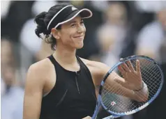  ??  ?? 0 Garbine Muguruza celebrates reaching the last four in Paris.