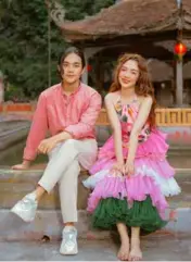  ?? ?? PRETTY IN PINK: Hoàng Duyên (right) in the new music video Chàng Trai Sơ Mi Hồng (The Boy in a Pink Shirt).