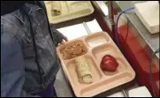  ?? Associated Press ?? A third-grader punches in her student identifica­tion to pay for a meal at Gonzales Community School in Santa Fe, New Mexico, in 2017.