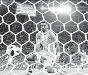  ?? Clive Mason Getty Images ?? RUI PATRICIO OF PORTUGAL reacts after being unable to stop Iran’s Karim Ansarifard’s penalty kick during the World Cup Group B match that ended in a 2-2 tie in Mordovia Arena in Saransk, Russia.