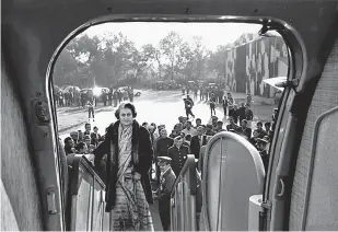  ?? Pictures: MARILYN STAFFORD ?? WINDOW ON THE WORLD: Indian prime minister Indira Ghandi boards a plane in New Delhi in 1971, above. Below, Algerian refugees at Tunisian camp in 1958