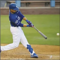  ?? Associated Press ?? BETTING ON BETTS
In this July 6 photo, the Dodgers’ Mookie Betts hits during intrasquad play in the restart of baseball’s spring training in Los Angeles. The Dodgers open the season at home on July 23 with a four-game series against the rival San Francisco Giants.