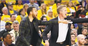  ?? Scott Strazzante / The Chronicle ?? Golden State’s Stephen Curry, left and head coach Steve Kerr react in the fourth quarter during Game 2 at the Oracle Arena on April 16.