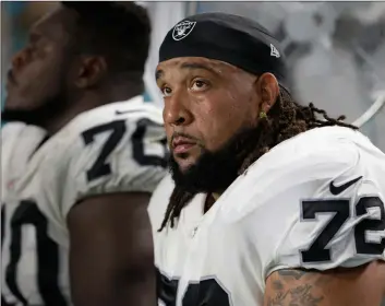  ??  ?? In this 2017, file photo, Oakland Raiders offensive tackle Donald Penn (72) sits on the sidelines during the first half of an NFL football game against the Miami Dolphins,in Miami Gardens, Fla. AP PHOTO/LyNNE SLADky