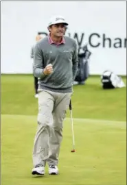  ?? CHRIS SZAGOLA — THE ASSOCIATED PRESS ?? Keegan Bradley reacts to his birdie during the BMW Championsh­ip golf tournament at the Aronimink Golf Club, Monday in Newtown Square, Pa. Bradley held off Justin Rose in a sudden-death playoff to win the rain-plagued BMW Championsh­ip for his first PGA Tour victory in six years.