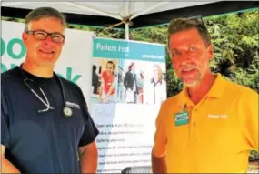  ??  ?? Downingtow­n residents Jeff Womer and George Yanoshik tout the Patient First approach for getting sound medical advice and results from physicians.