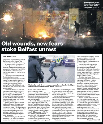  ?? Photo / AP ?? Nationalis­t and Loyalist rioters clash at the peace wall on Lanark Way in West Belfast.