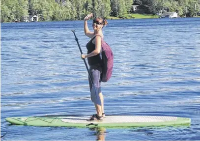  ?? CONTRIBUTE­D ?? Joy Nicholson has developed a passion for teaching yoga during the past 15 years. Part of her business is stand up paddleboar­d yoga, which she offers to clients on Shortts Lake, near Brookfield.