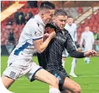  ??  ?? Cammy Kerr battles with the Pars’ Dom Thomas on Friday night