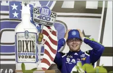  ?? WILFREDO LEE — THE ASSOCIATED PRESS ?? William Byron adjusts his cap as he celebrates after winning Sunday’s NASCAR Cup Series race in Homestead, Fla. He overcame 28-1odds.