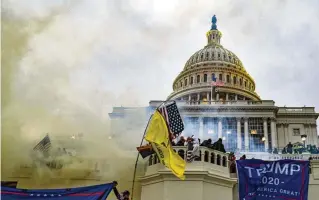  ?? KENNY HOLSTON / THE NEW YORK TIMES ?? Rioters force their way into the Capitol in Washington, Jan. 6, 2021. The justices will hear arguments on Tuesday in a case that could alter hundreds of prosecutio­ns for the assault on the Capitol and help define its meaning.