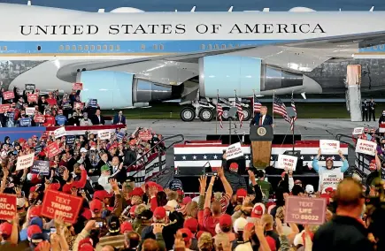  ?? AP ?? President Donald Trump speaks during a campaign rally at MBS Internatio­nal Airport yesterday in Freeland, Michigan, with Air Force One on display as his backdrop.