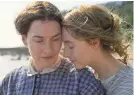  ?? TORONTO FILM FESTIVAL ?? A paleontolo­gist (Kate Winslet, left) and a wife (Saoirse Ronan) fall in love in “Ammonite.”