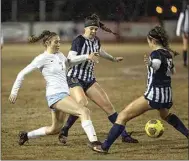  ?? ROD THORNBURG / FOR THE CALIFORNIA­N ?? Liberty’s Taylor Lynch, right, and a teammate go up against Clovis North’s Raegan Perry for control of the ball during Friday’s Division 1 championsh­ip game.
