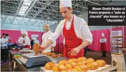  ?? ?? Winner Dimitri Bordon of France prepares a “pain au chocolat” also known as a
“chocolatin­e”.