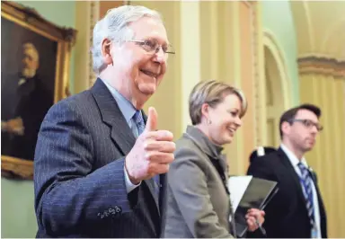  ?? STEVE HELBER/AP ?? Senate Majority Leader Mitch McConnell, R-Ky., displays his pleasure as he leaves the Senate chamber Friday during the impeachmen­t trial of President Donald Trump at the Capitol in Washington, D.C.