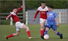  ??  ?? Liam Evans and Anthony Murphy of Moyne Rangers close in on North End’s Leon Sinnott.