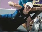  ?? FERNANDO LLANO/AP ?? Poland’s Iga Swiatek poses for photos after winning the WTA Finals last year in Mexico. The WTA announced on Thursday that the season-ending event for the top eight women’s singles players and doubles teams will take place in Saudi Arabia from 2024 to 2026.