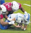  ?? ROSS D. FRANKLIN — THE ASSOCIATED PRESS ?? Detroit Lions quarterbac­k Matthew Stafford is sacked by Arizona Cardinals defense on Sept. 27.