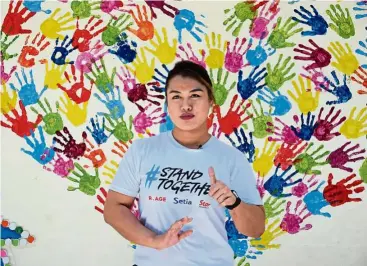  ??  ?? Former martial arts fighter Ann Osman overcame her childhood bullying, and hopes to help others do the same by giving a free self-defence demo at the #StandToget­her Carnival on April 15. — Photos: Handout