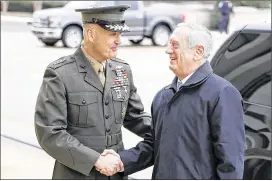  ?? ALEX BRANDON / ASSOCIATED PRESS ?? Joint Chiefs Chairman Gen. Joseph Dunford (left) greets Defense Secretary Jim Mattis at the Pentagon. Dunford said last week that the emerging strategy will target not just Islamic State militants but also al-Qaida and other extremist organizati­ons in...